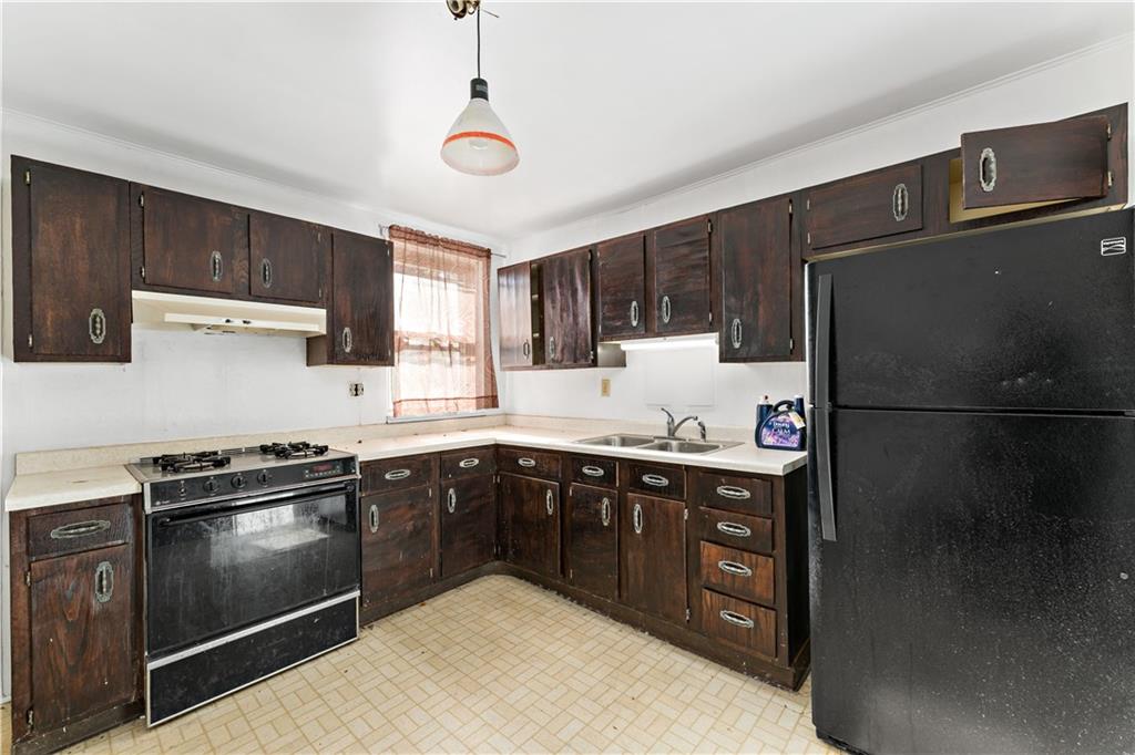 308 Merrimac Street Pittsburgh, PA 15211 - Photo 8 of 43 a kitchen with a sink appliances and cabinets