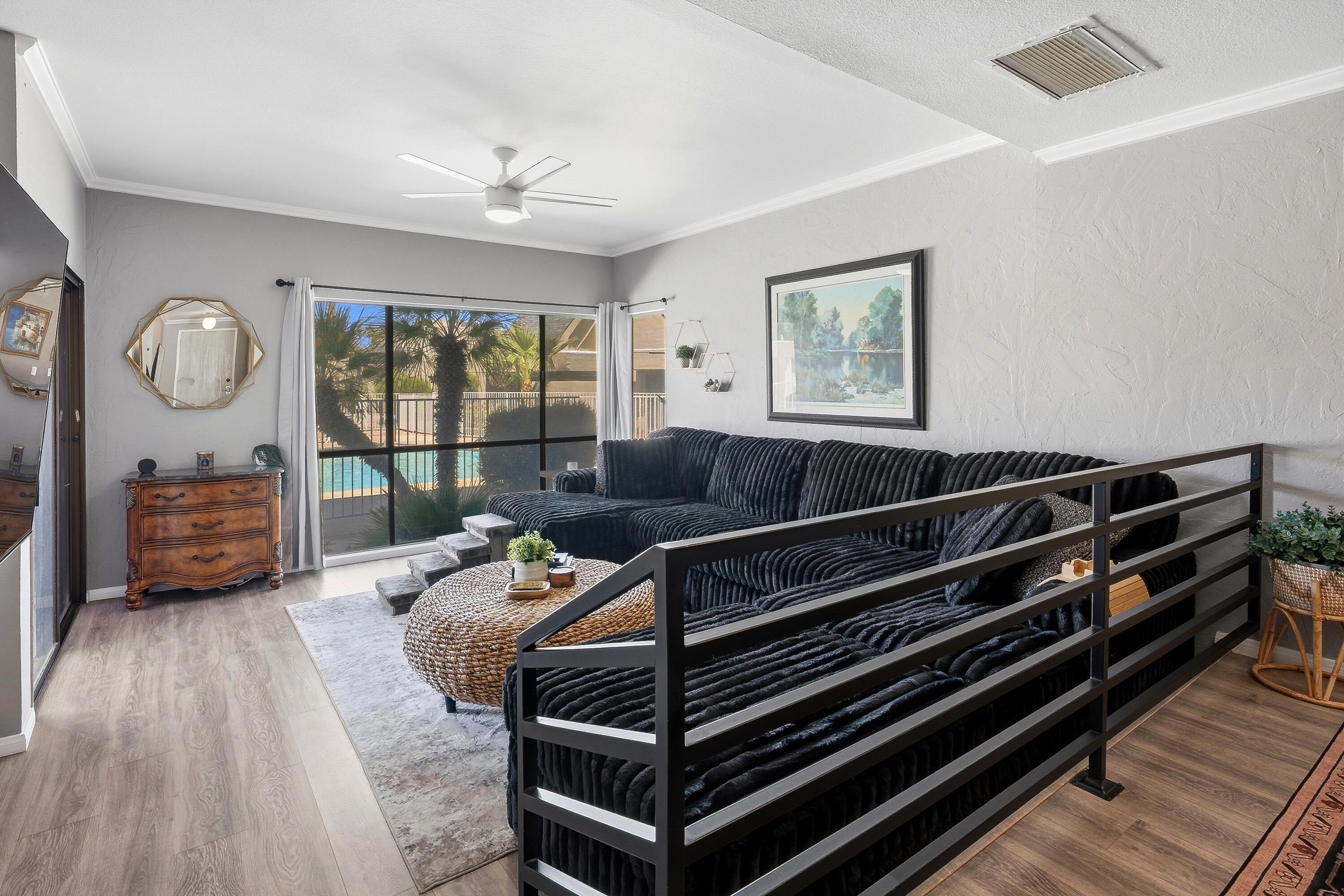 71870 Eleanora Lane Rancho Mirage, CA 92270 - Photo 2 of 36 a living room with furniture a bed and a large window