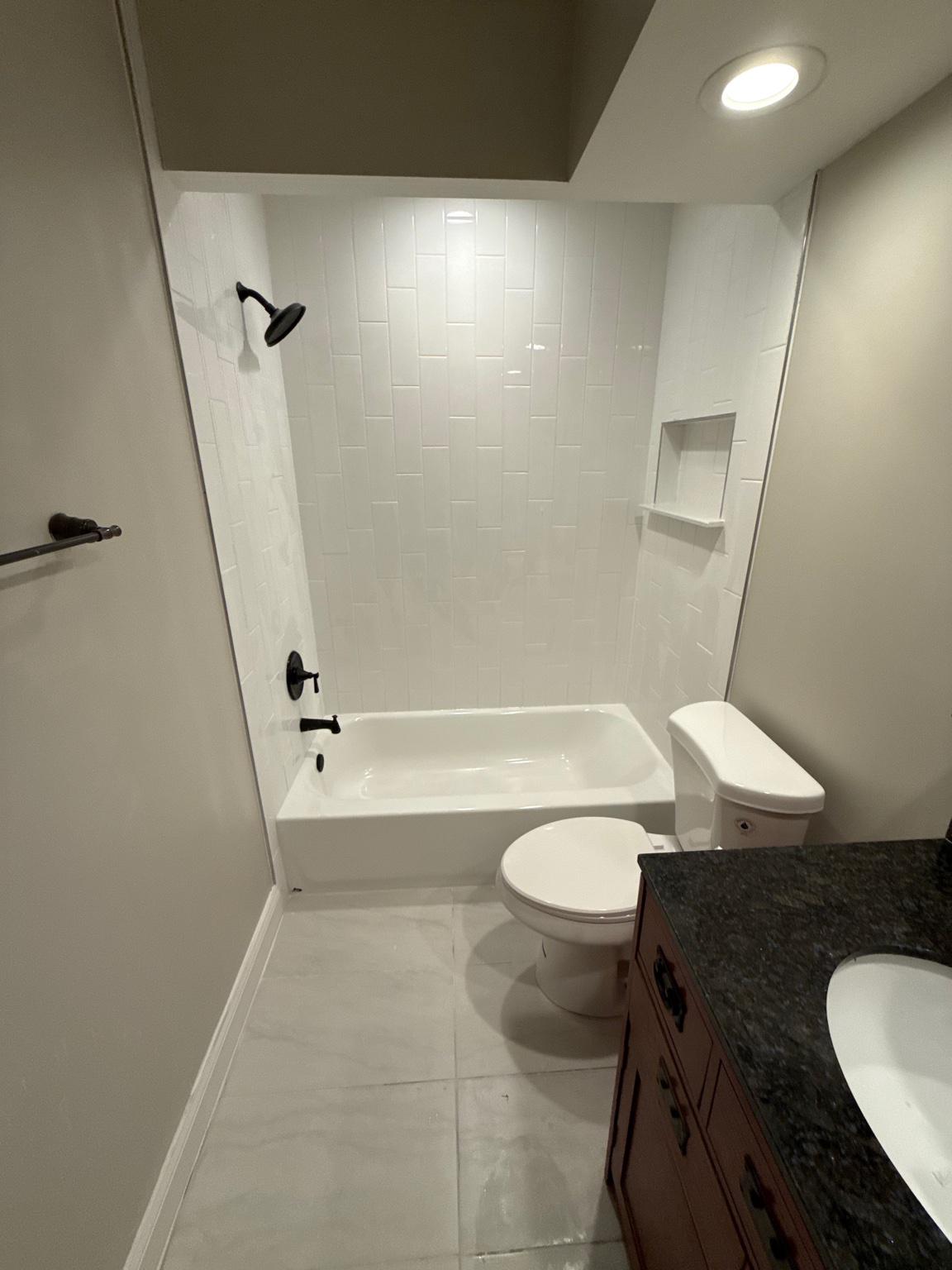 5423 Rilian Court Burke, VA 22015 - Photo 56 of 67 a bathroom with a sink a toilet a mirror and shower