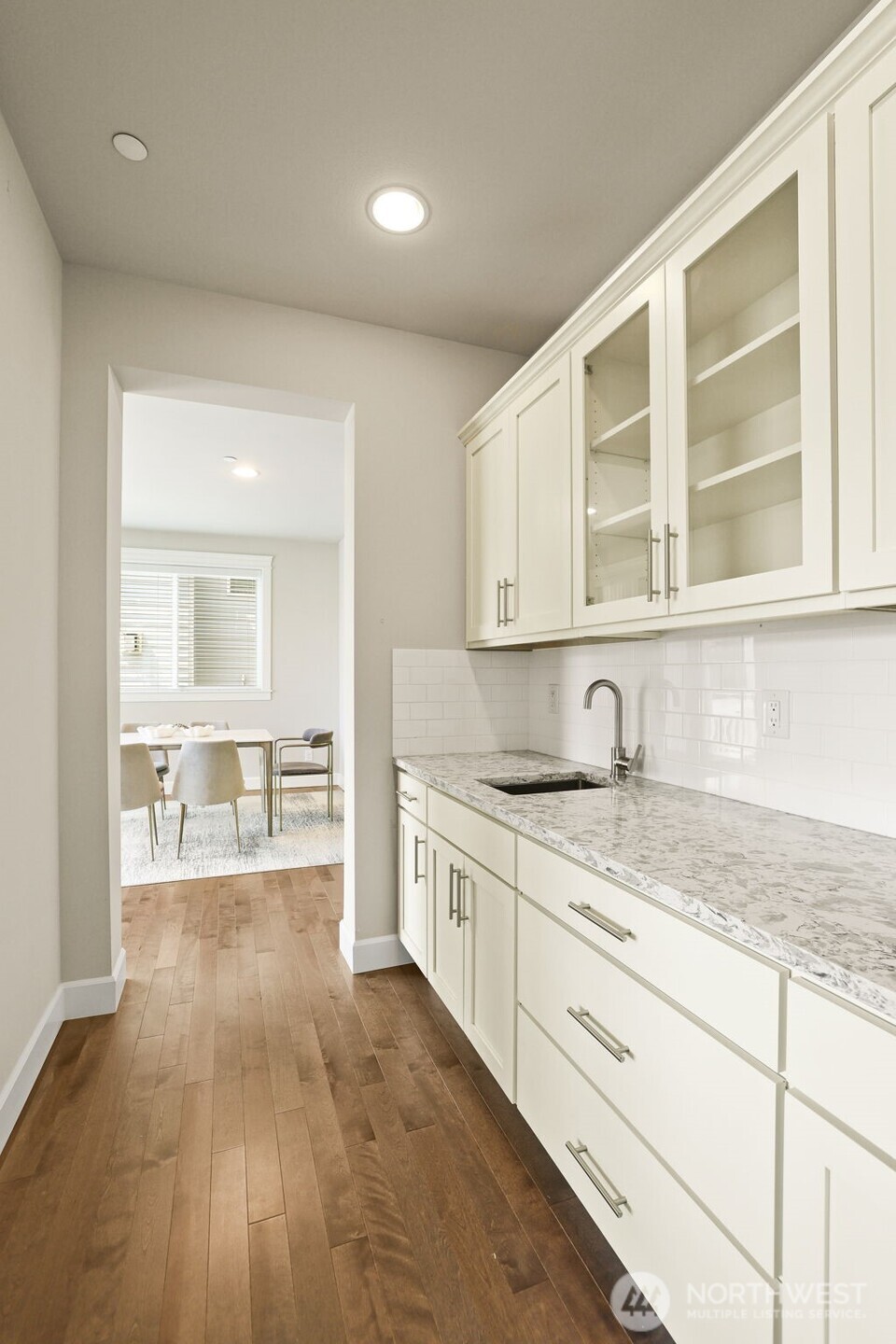 29 242nd Street Southeast Bothell, WA 98021 - Photo 13 of 40 a kitchen with granite countertop a sink and cabinets