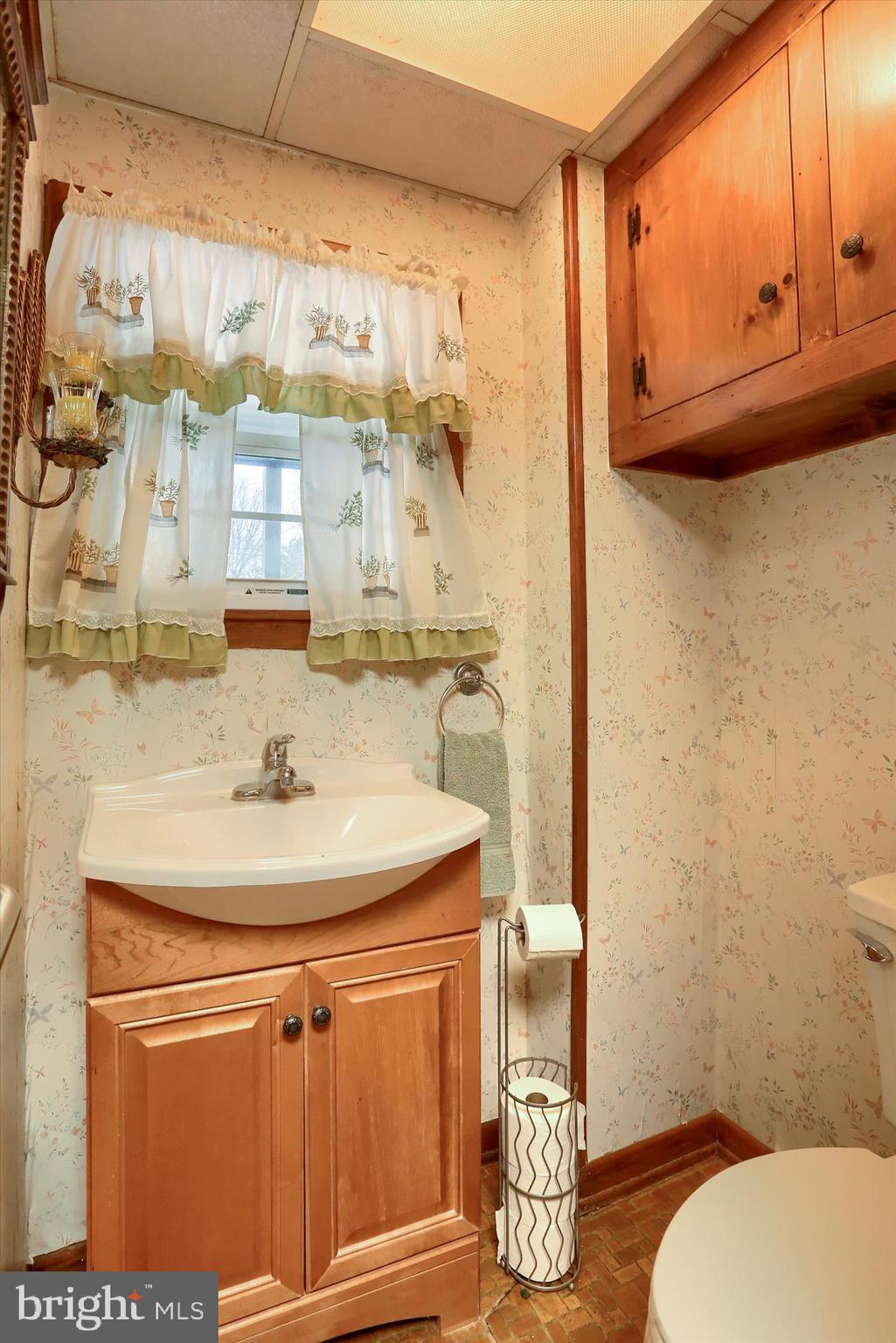 204 South Market Street Liverpool, PA 17045 - Photo 12 of 38 a bathroom with a sink a toilet and mirror