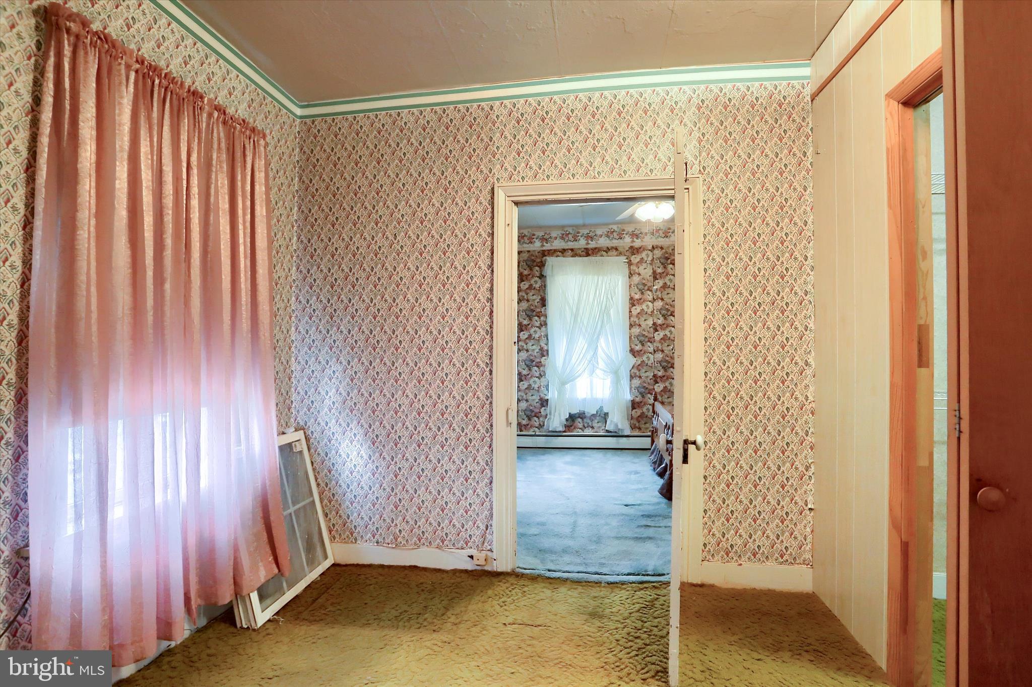 204 South Market Street Liverpool, PA 17045 - Photo 17 of 38 an empty room with wooden floor and a window