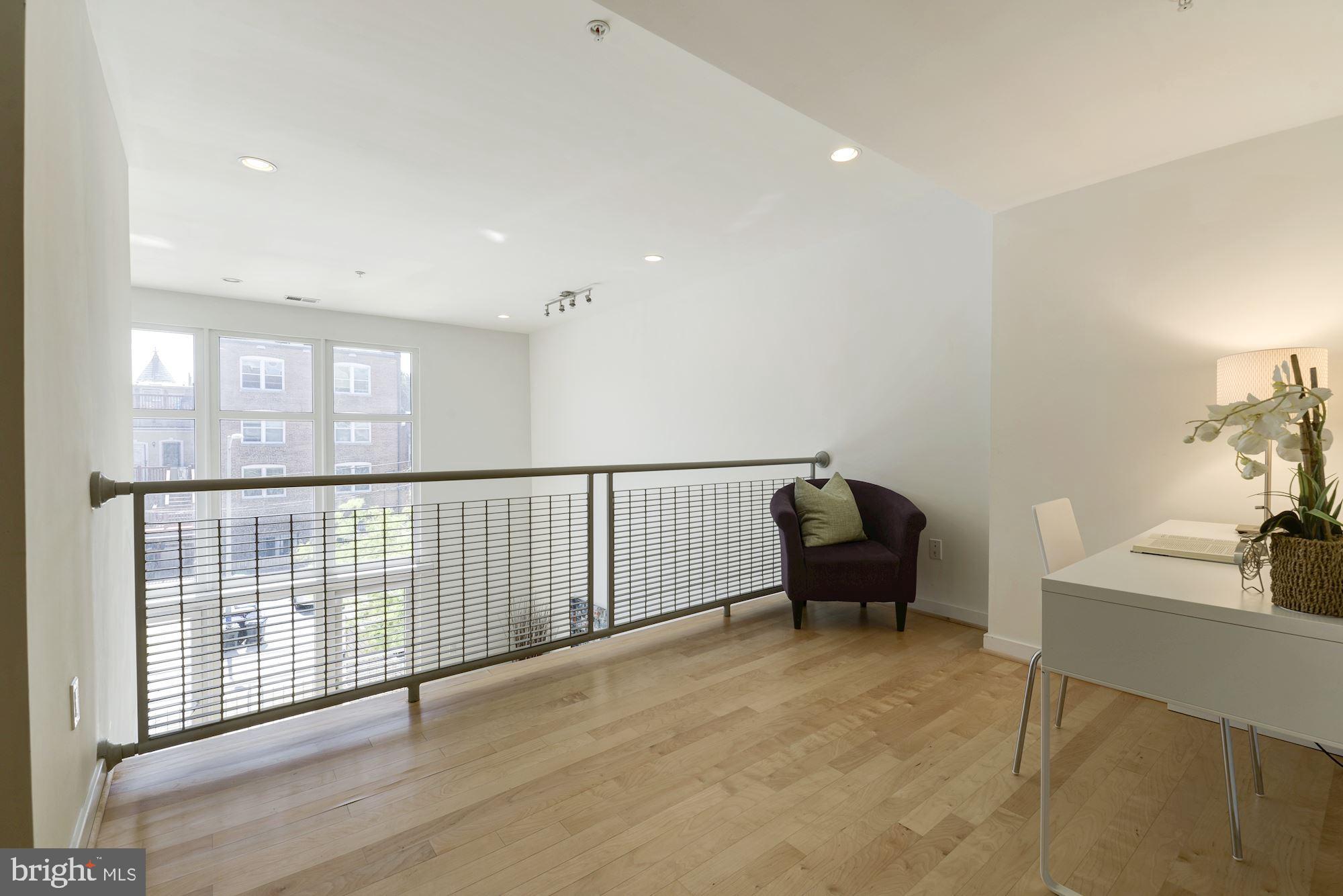 1466 Harvard Street Northwest, Unit A2 Washington, DC 20009 - Photo 11 of 21 a living room with furniture and a large window