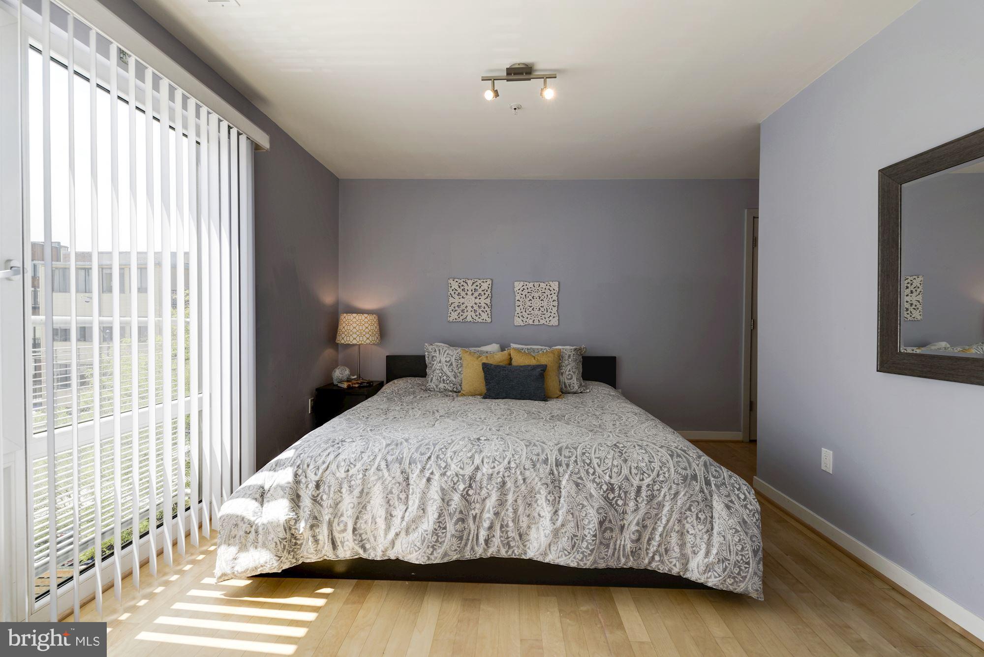 1466 Harvard Street Northwest, Unit A2 Washington, DC 20009 - Photo 13 of 21 a bedroom with a bed and window