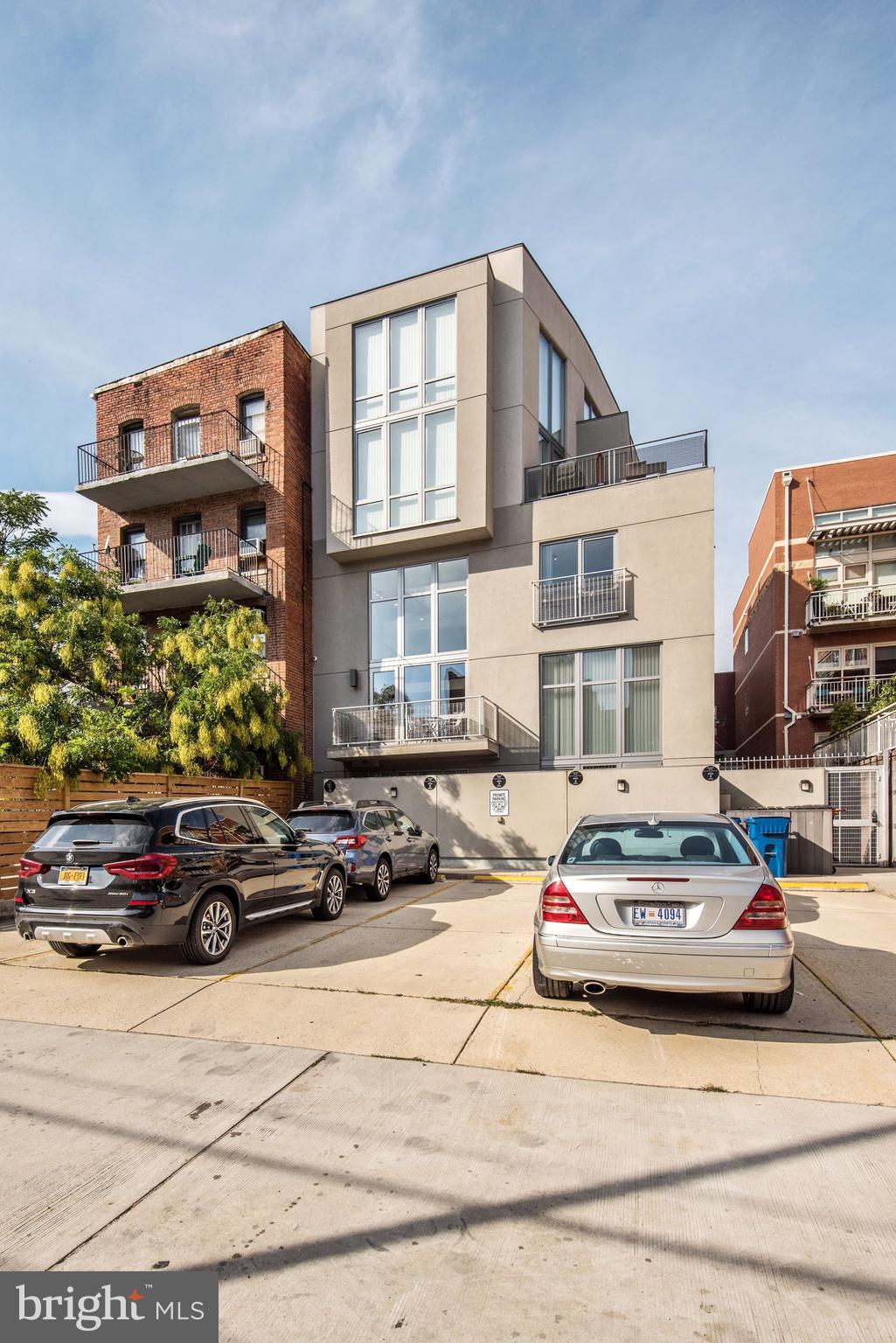 1466 Harvard Street Northwest, Unit A2 Washington, DC 20009 - Photo 18 of 21 a car parked in front of a building