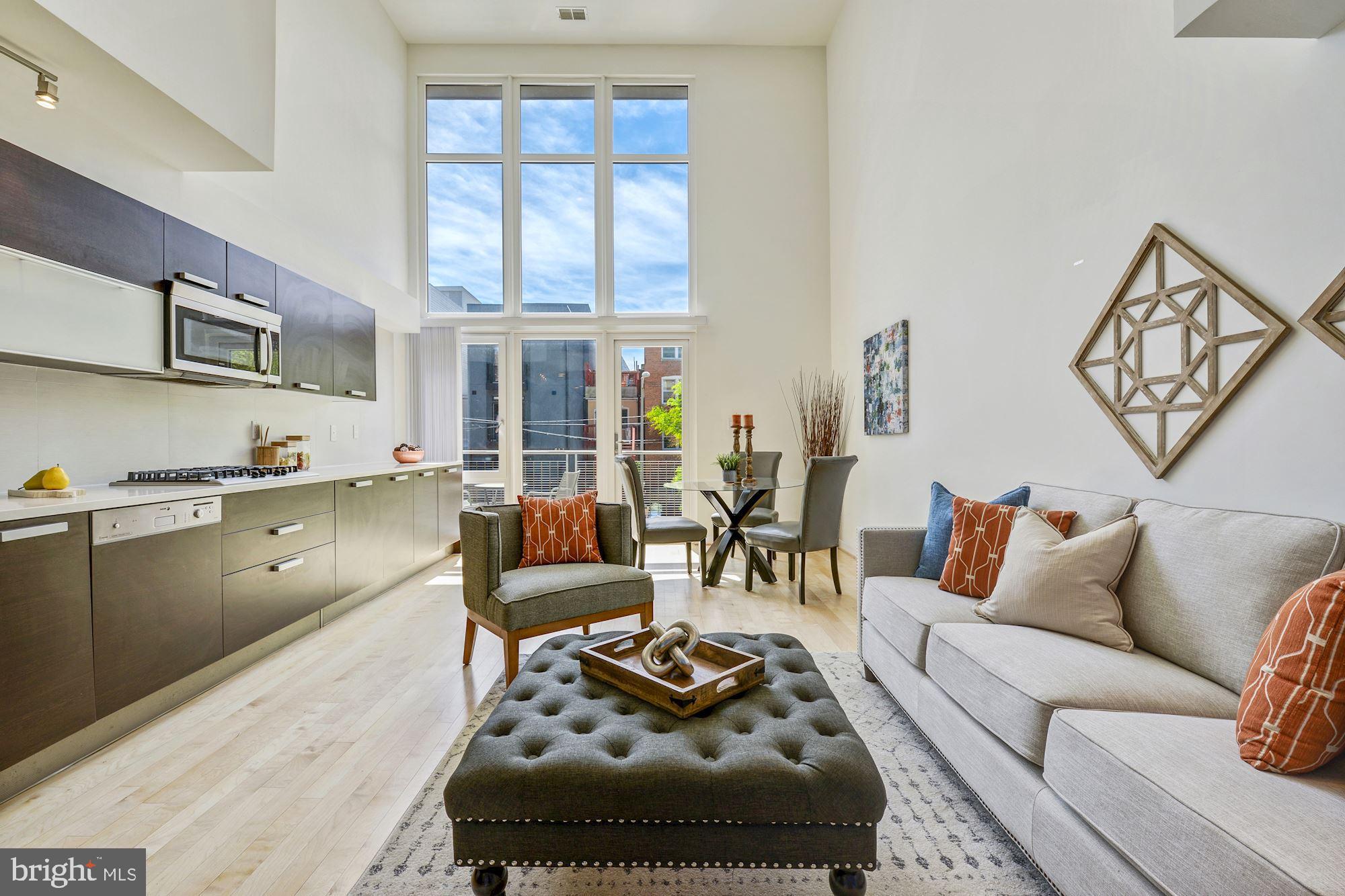 1466 Harvard Street Northwest, Unit A2 Washington, DC 20009 - Photo 21 of 21 a living room with furniture and a kitchen