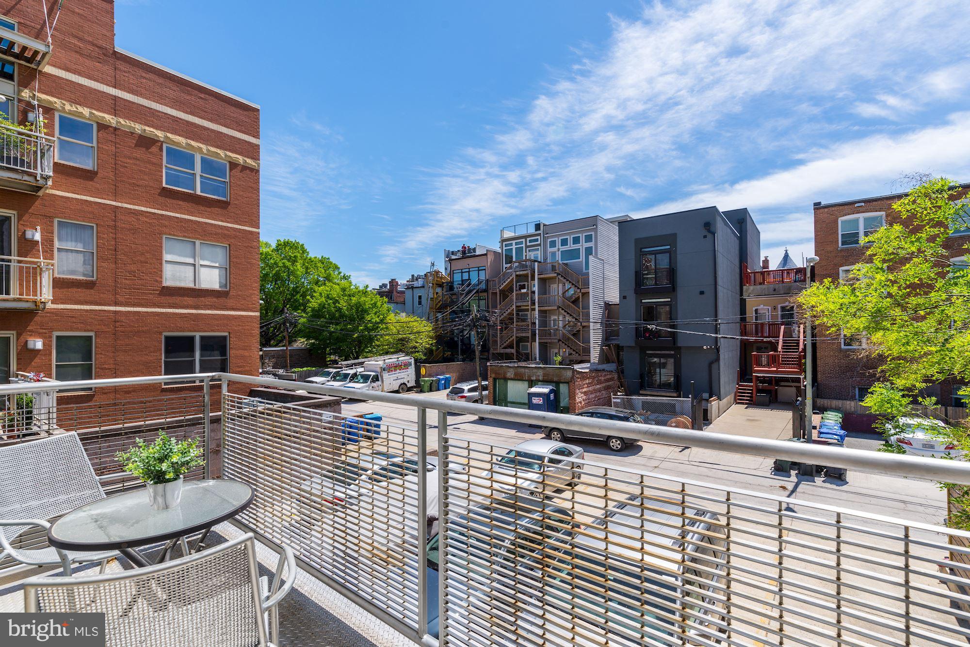 1466 Harvard Street Northwest, Unit A2 Washington, DC 20009 - Photo 6 of 21 a view of a patio with couches table and chairs and potted plants
