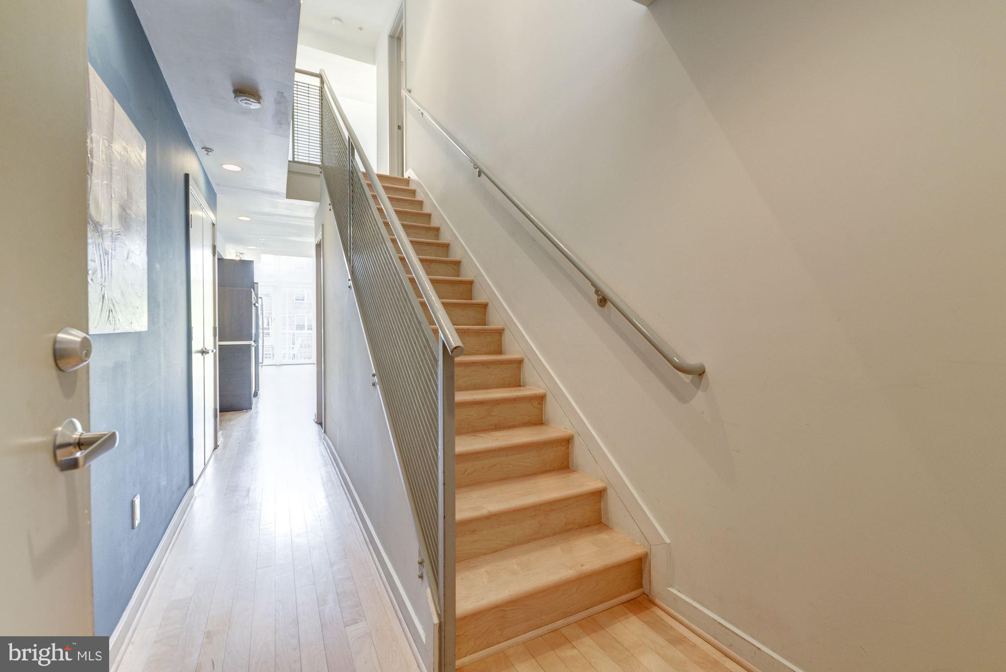 1466 Harvard Street Northwest, Unit A2 Washington, DC 20009 - Photo 9 of 21 a view of staircase with white walls and a window