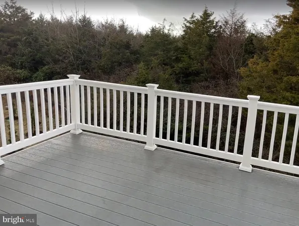 a view of balcony with wooden floor