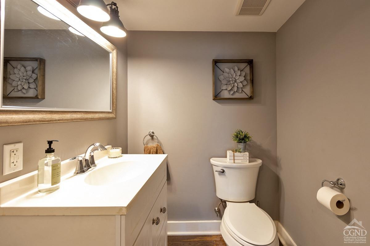 0 3327 Route 199 Pine Plains, NY 12567 - Photo 11 of 43 a bathroom with a sink mirror and toilet
