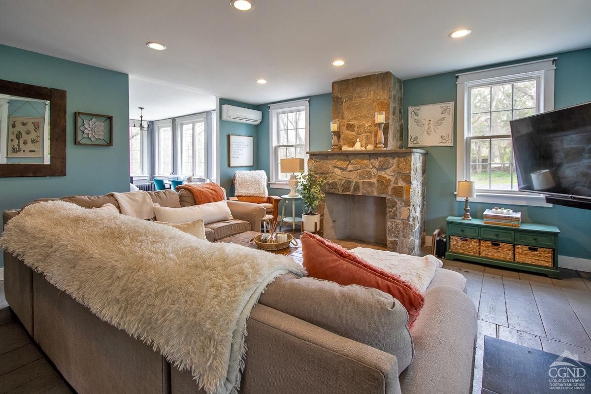 0 3327 Route 199 Pine Plains, NY 12567 - Photo 12 of 43 a living room with furniture fireplace and flat screen tv
