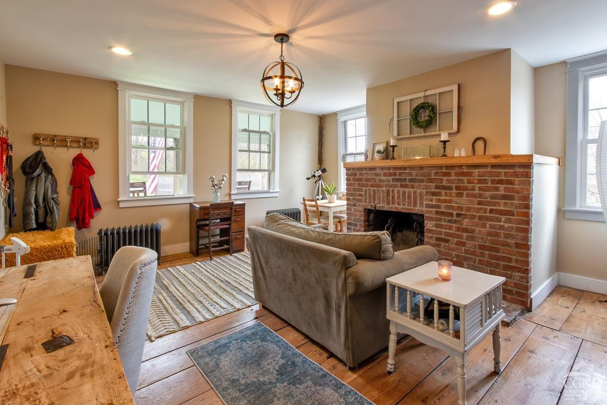 0 3327 Route 199 Pine Plains, NY 12567 - Photo 16 of 43 a living room with furniture and a fireplace