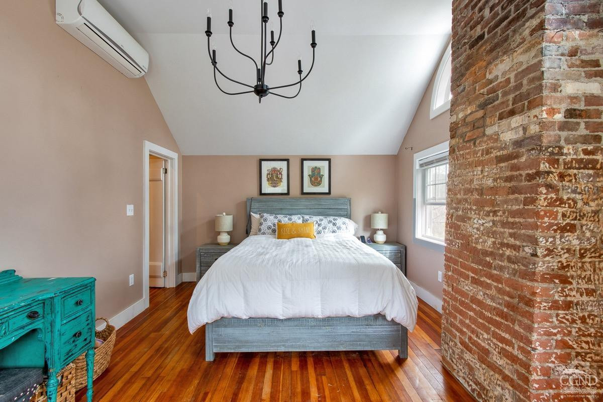 0 3327 Route 199 Pine Plains, NY 12567 - Photo 19 of 43 a bedroom with a bed and wooden floor