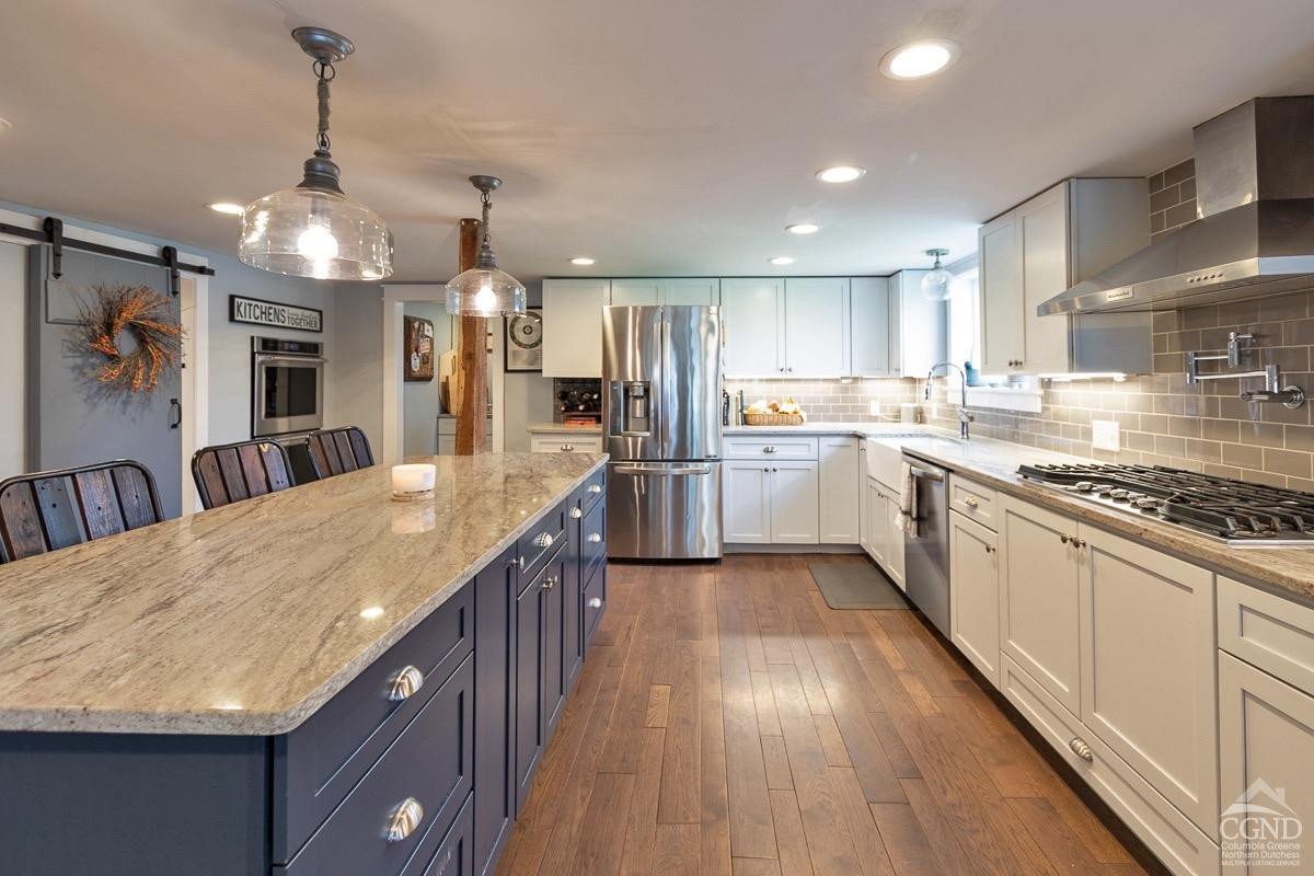 0 3327 Route 199 Pine Plains, NY 12567 - Photo 3 of 43 a large kitchen with granite countertop a large center island a sink stainless steel appliances and cabinets
