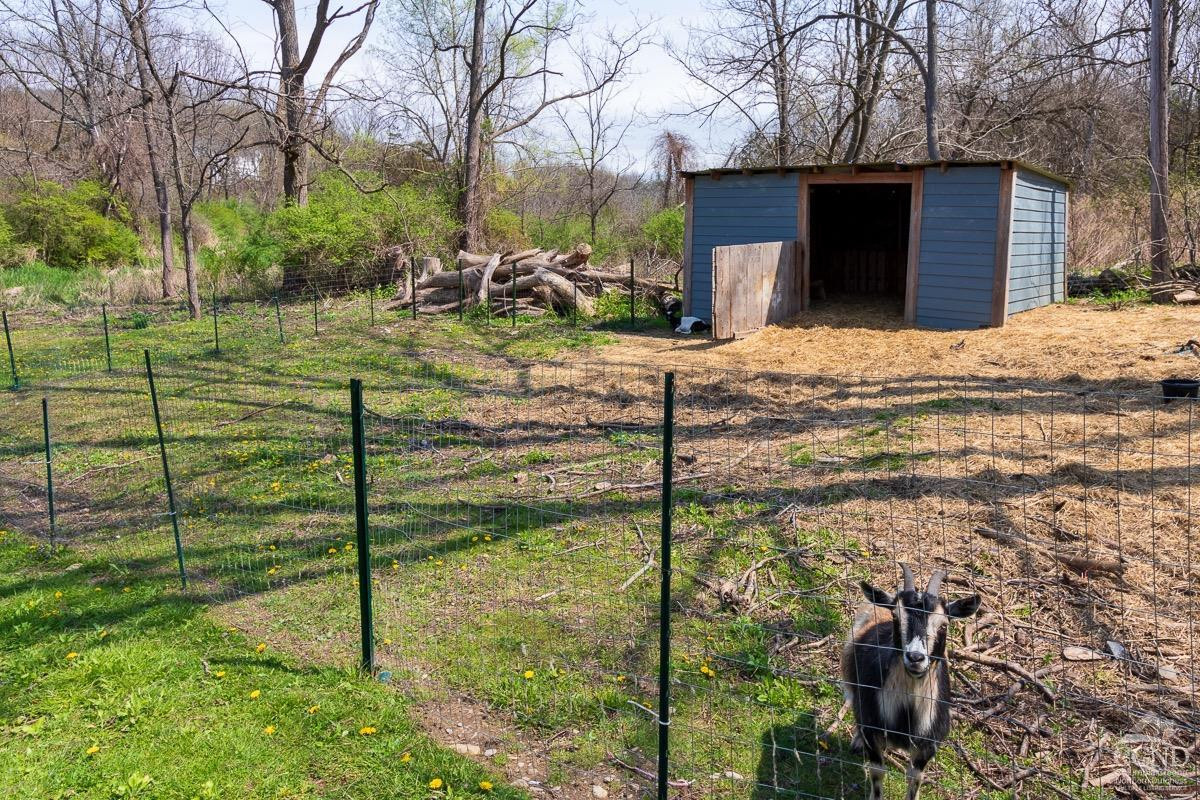 0 3327 Route 199 Pine Plains, NY 12567 - Photo 35 of 43 a view of a backyard with table and chairs and wooden fence
