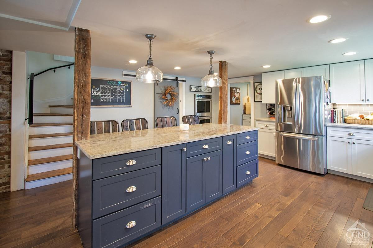 0 3327 Route 199 Pine Plains, NY 12567 - Photo 4 of 43 a kitchen with stainless steel appliances kitchen island granite countertop a refrigerator and a sink