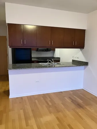 a kitchen with granite countertop a cabinets