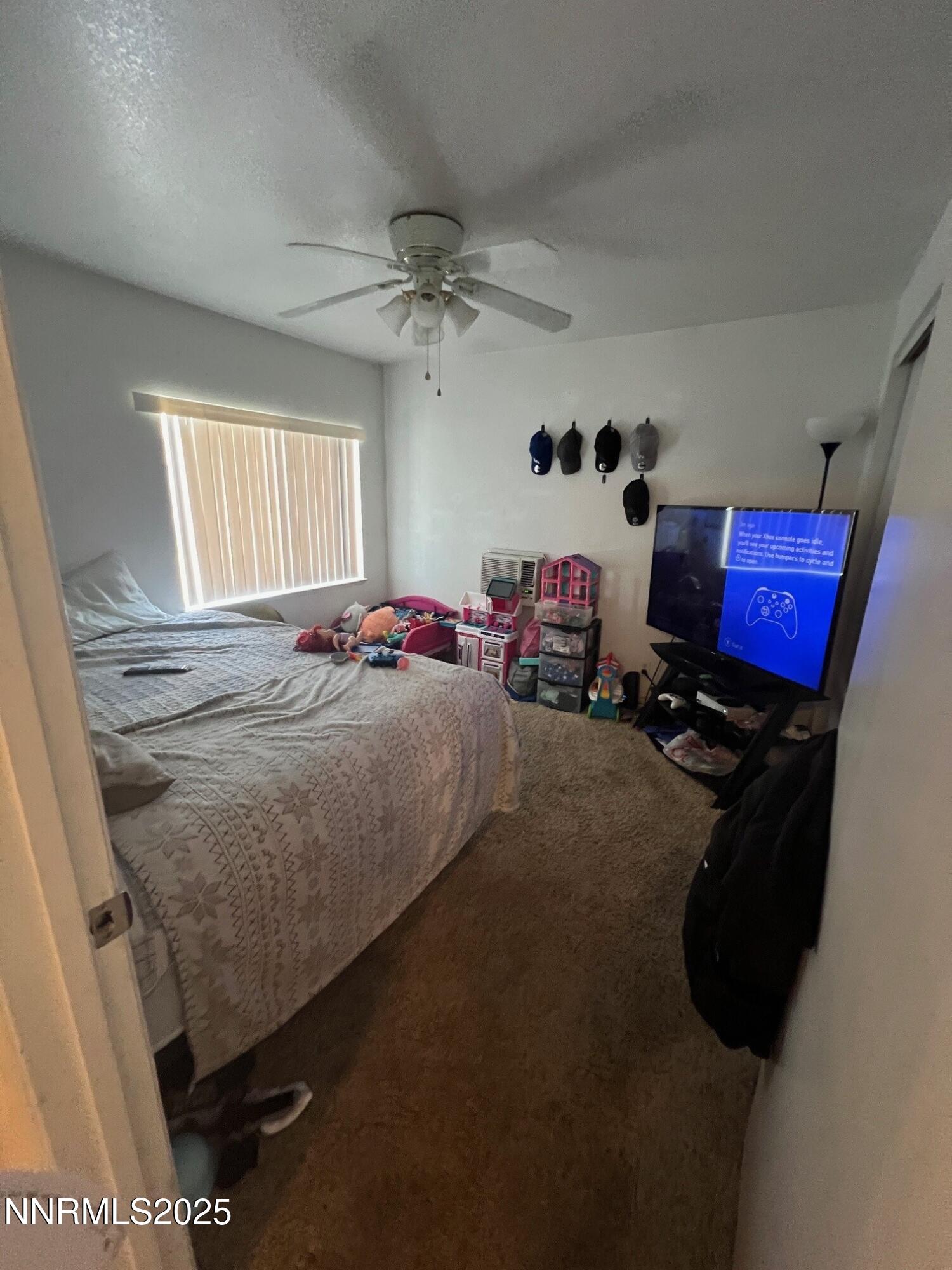 650 Elko Avenue Reno, NV 89512 - Photo 8 of 27 a bedroom with bed and a window