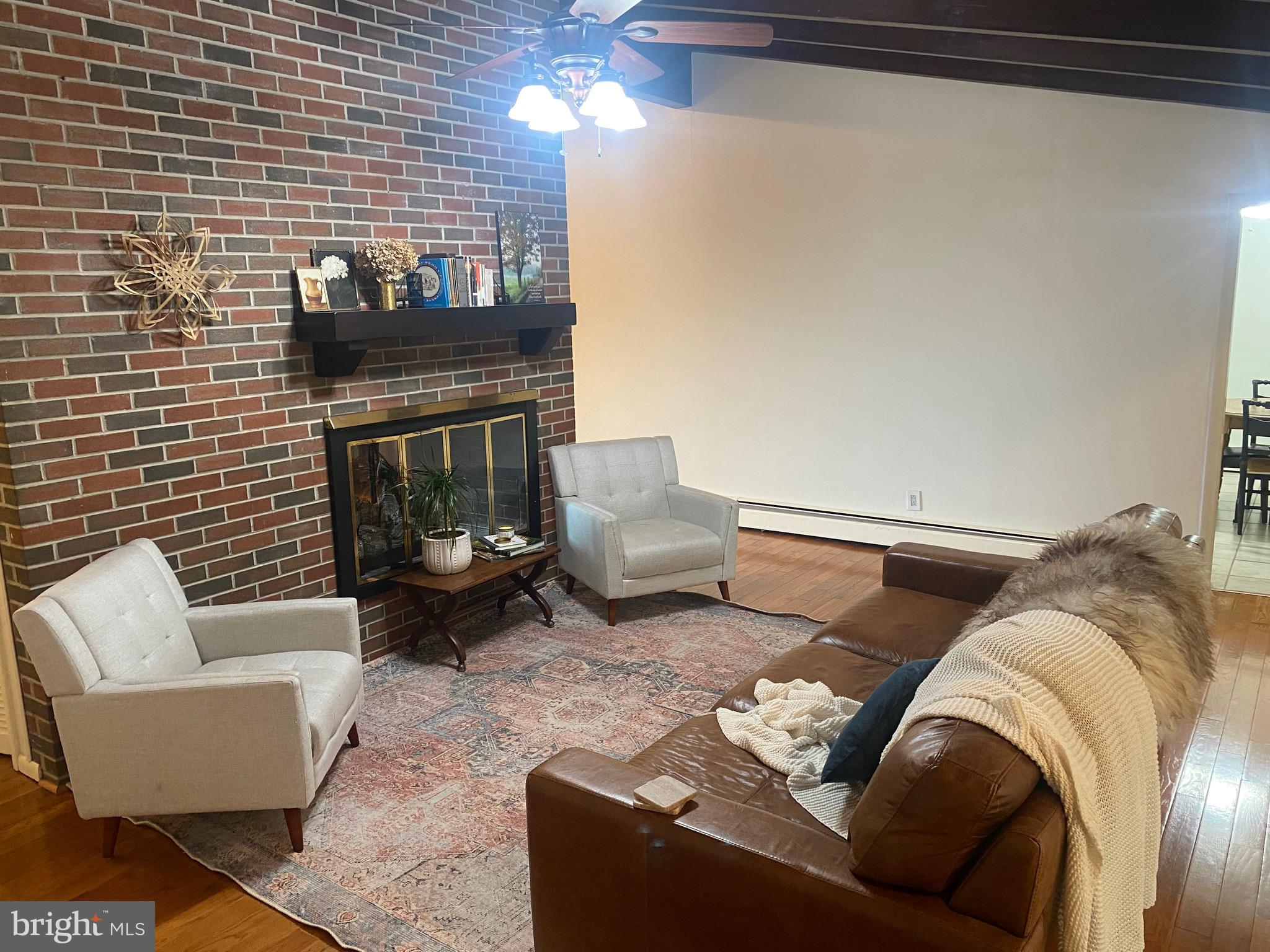 117 West Adams Street Georgetown, DE 19947 - Photo 14 of 20 a living room with furniture and a fireplace
