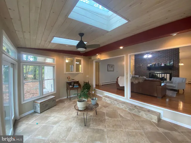 a lobby with furniture and a table