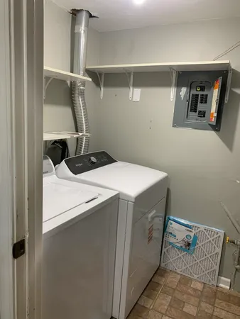 a utility room with dryer and washer