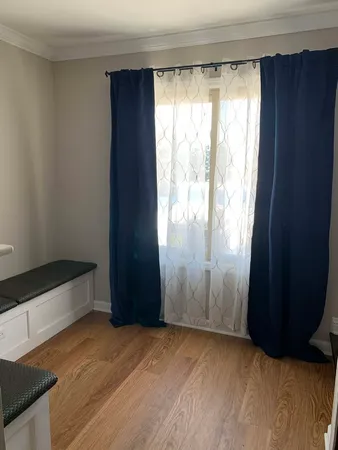 a view of an empty room and window