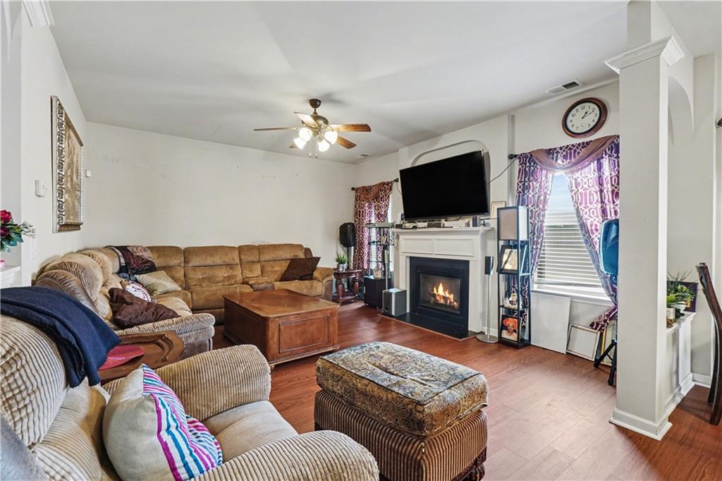 4157 Sublime Trail Atlanta, GA 30349 - Photo 11 of 20 a living room with furniture a fireplace and a flat screen tv