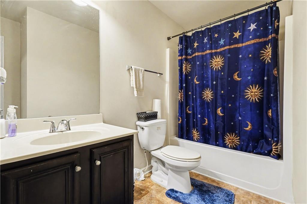 4157 Sublime Trail Atlanta, GA 30349 - Photo 18 of 20 a bathroom with a sink and a mirror