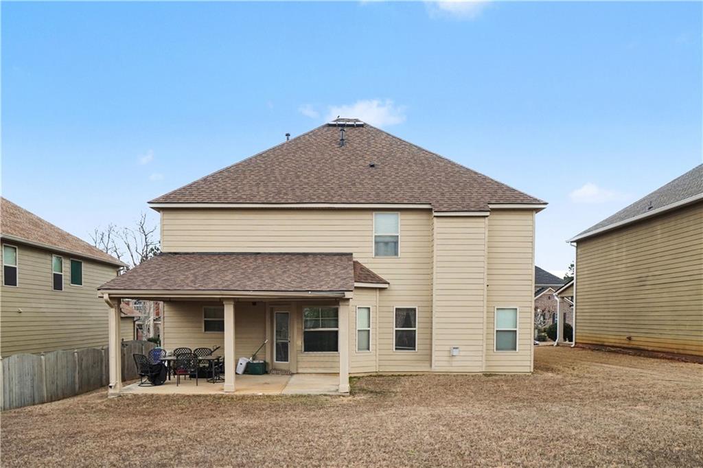 4157 Sublime Trail Atlanta, GA 30349 - Photo 20 of 20 a front view of a house with garden