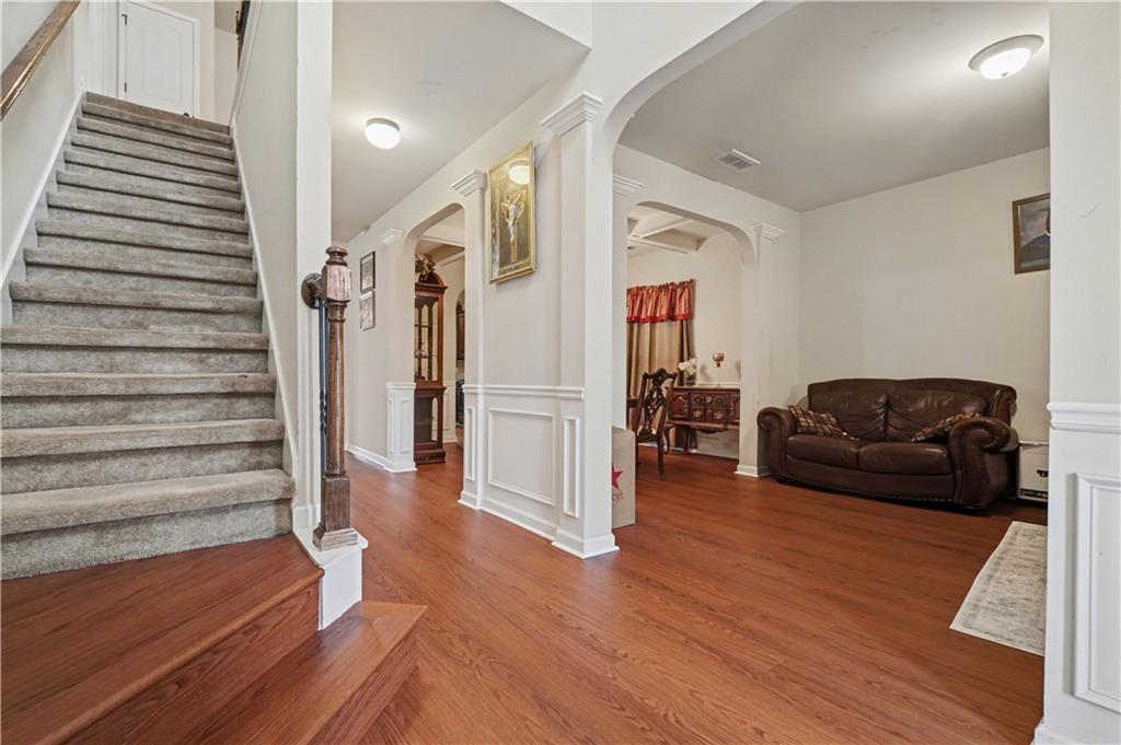 4157 Sublime Trail Atlanta, GA 30349 - Photo 2 of 20 a living room with furniture and a wooden floor
