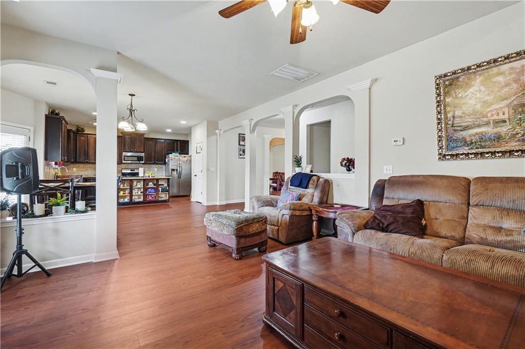 4157 Sublime Trail Atlanta, GA 30349 - Photo 10 of 20 a living room with furniture and wooden floor