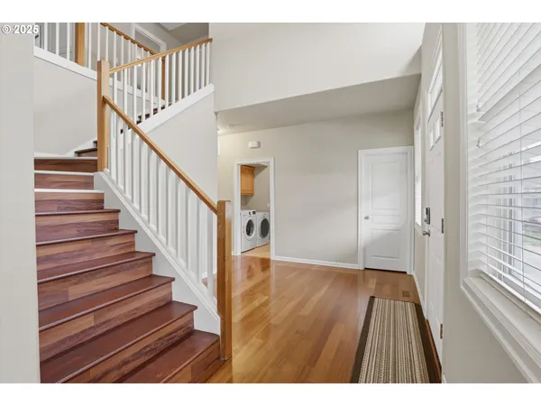 a view of entryway with wooden floor