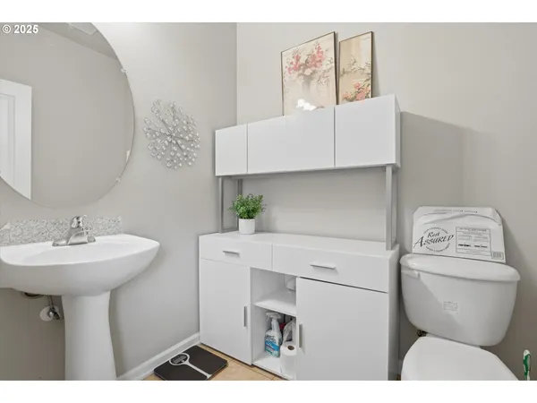a bathroom with a sink toilet and vanity