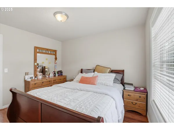a bedroom with a bed and a dresser