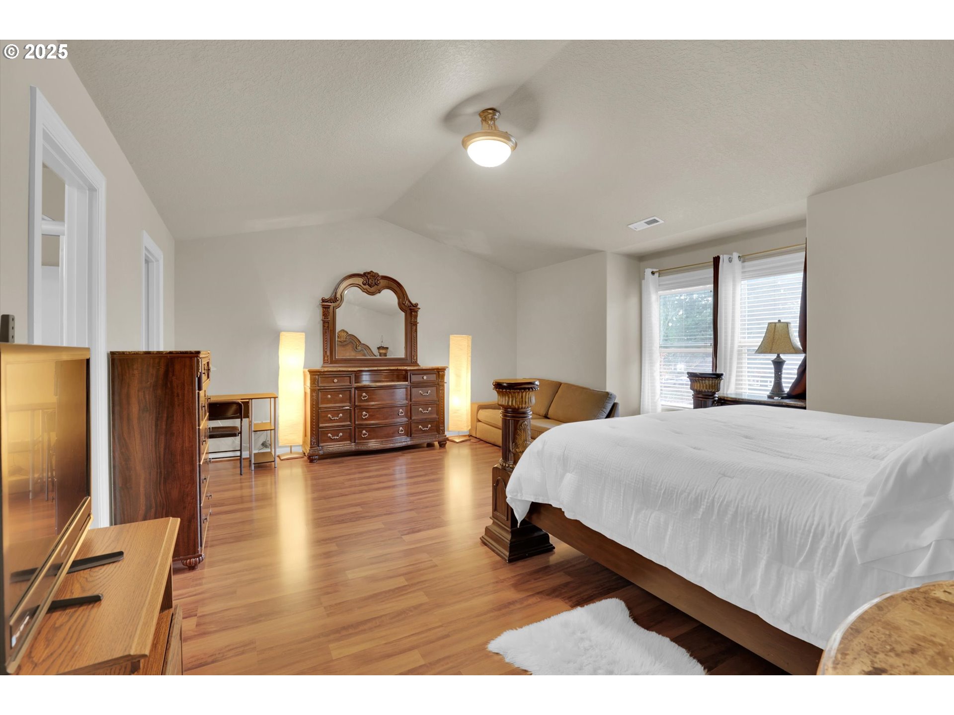 3718 Southeast 127th Place Portland, OR 97236 - Photo 25 of 31 a living room with furniture and a flat screen tv