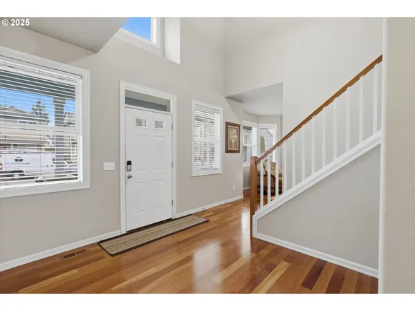 a view of an entryway with wooden floor