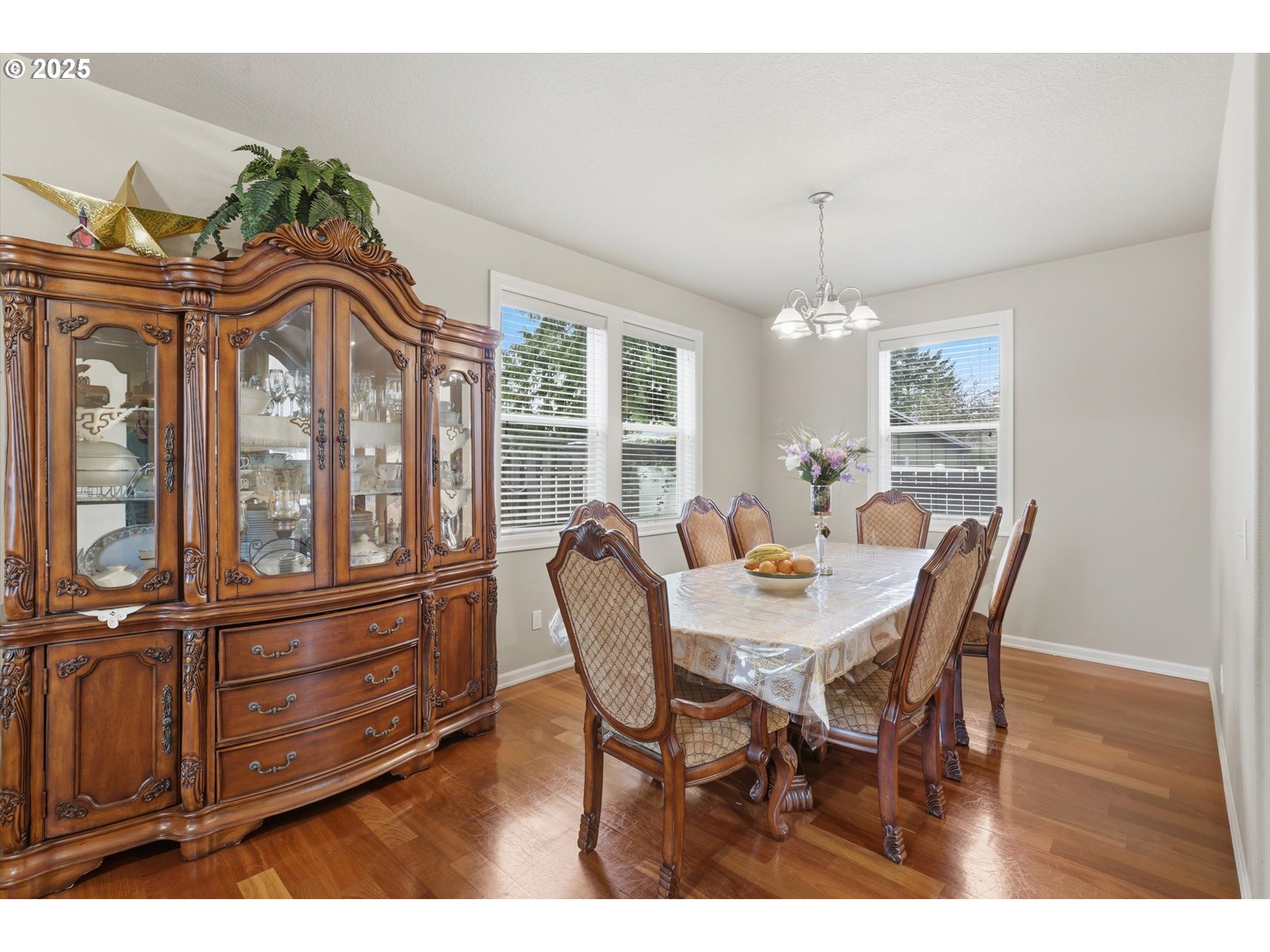3718 Southeast 127th Place Portland, OR 97236 - Photo 6 of 31 a view of a dining room with furniture window and wooden floor