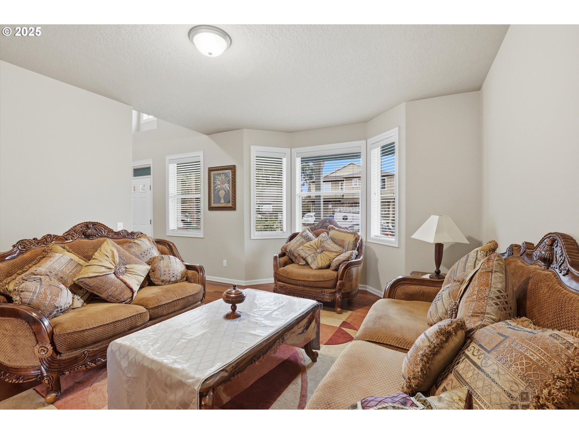 3718 Southeast 127th Place Portland, OR 97236 - Photo 7 of 31 a bedroom with furniture and a bed