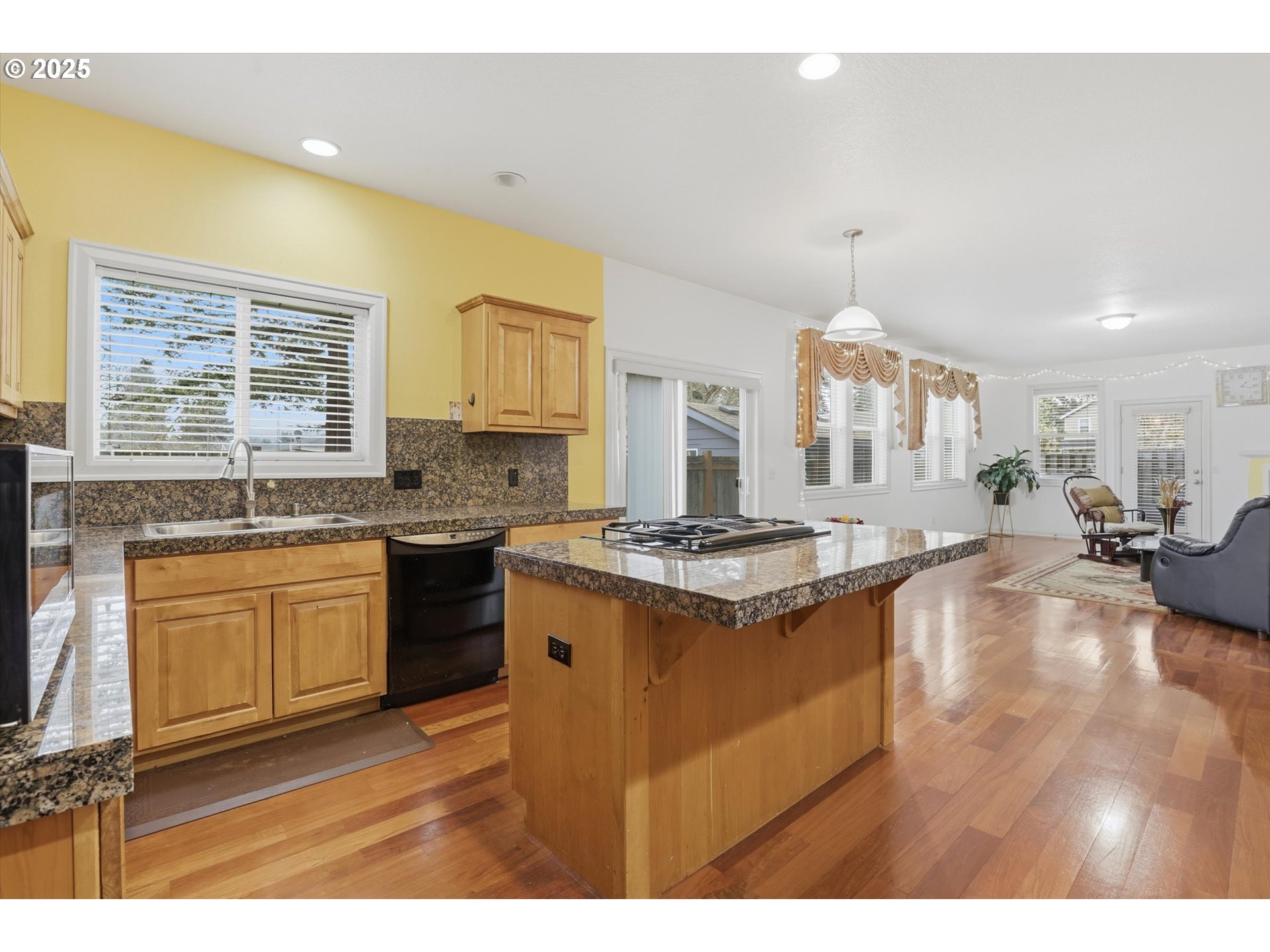 3718 Southeast 127th Place Portland, OR 97236 - Photo 10 of 31 a kitchen with stainless steel appliances granite countertop a stove a sink dishwasher and a stove with granite countertops