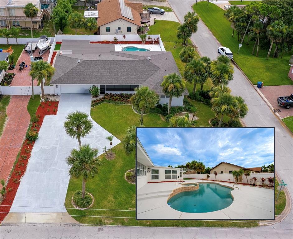 an aerial view of a house with a swimming pool