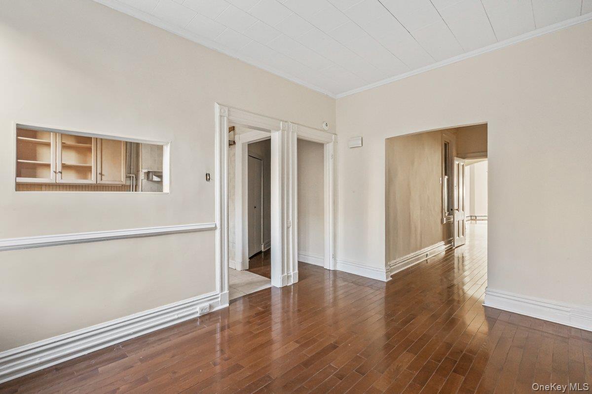 62 Sutton Street Brooklyn, NY 11222 - Photo 24 of 29 an empty room with wooden floor and windows