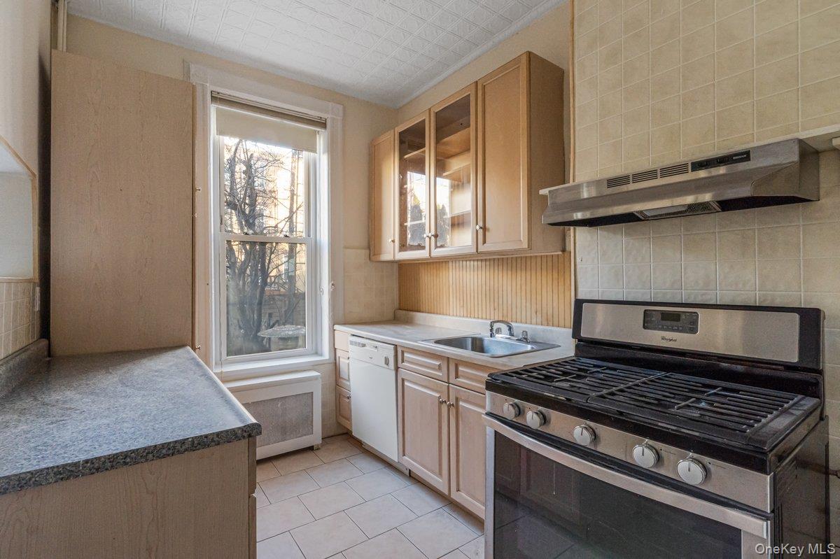 62 Sutton Street Brooklyn, NY 11222 - Photo 25 of 29 a stove top oven sitting inside of a kitchen