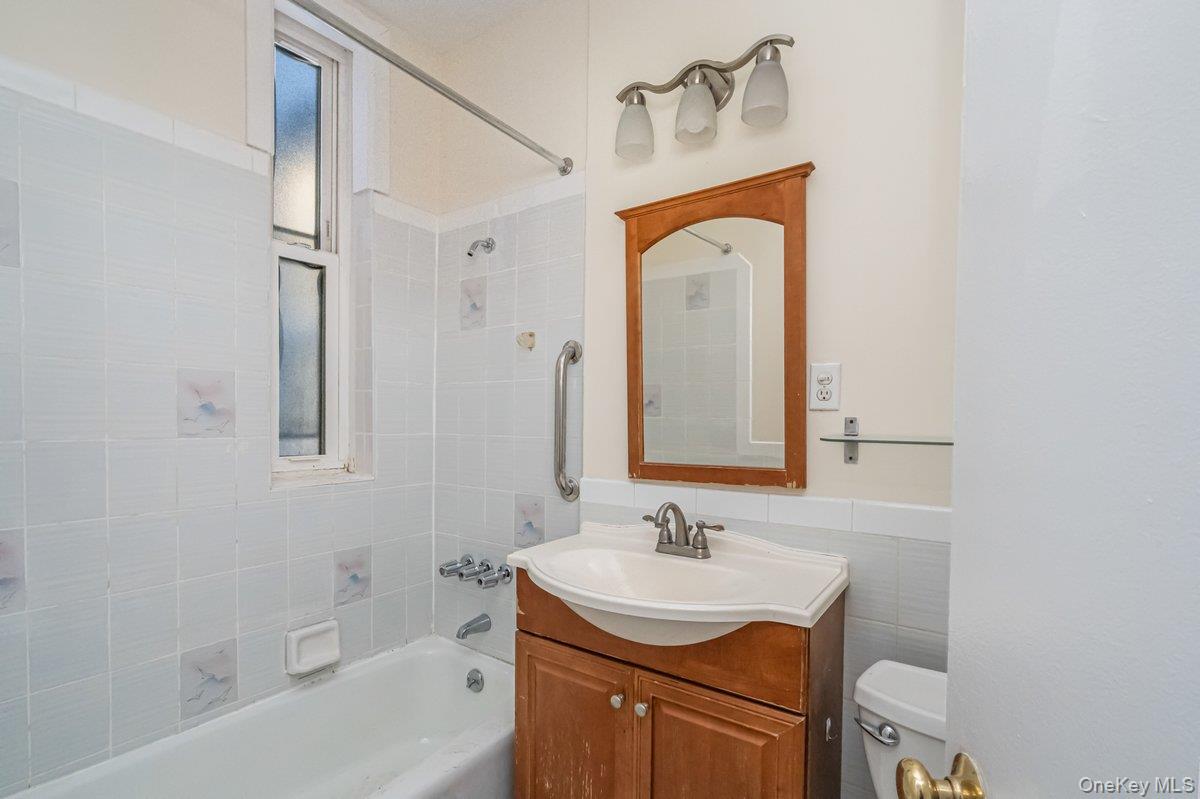 62 Sutton Street Brooklyn, NY 11222 - Photo 27 of 29 a bathroom with a sink a toilet and shower