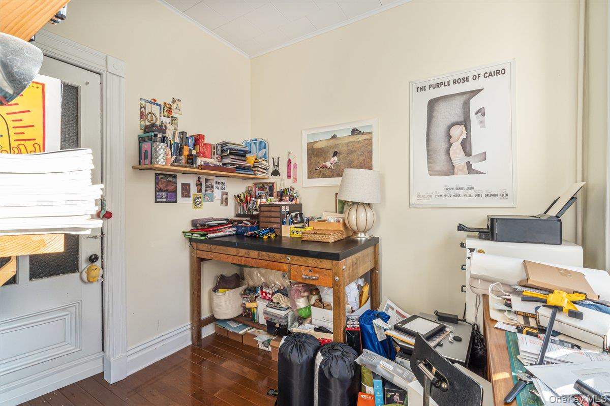62 Sutton Street Brooklyn, NY 11222 - Photo 7 of 29 a view of a workspace with furniture and a kitchen