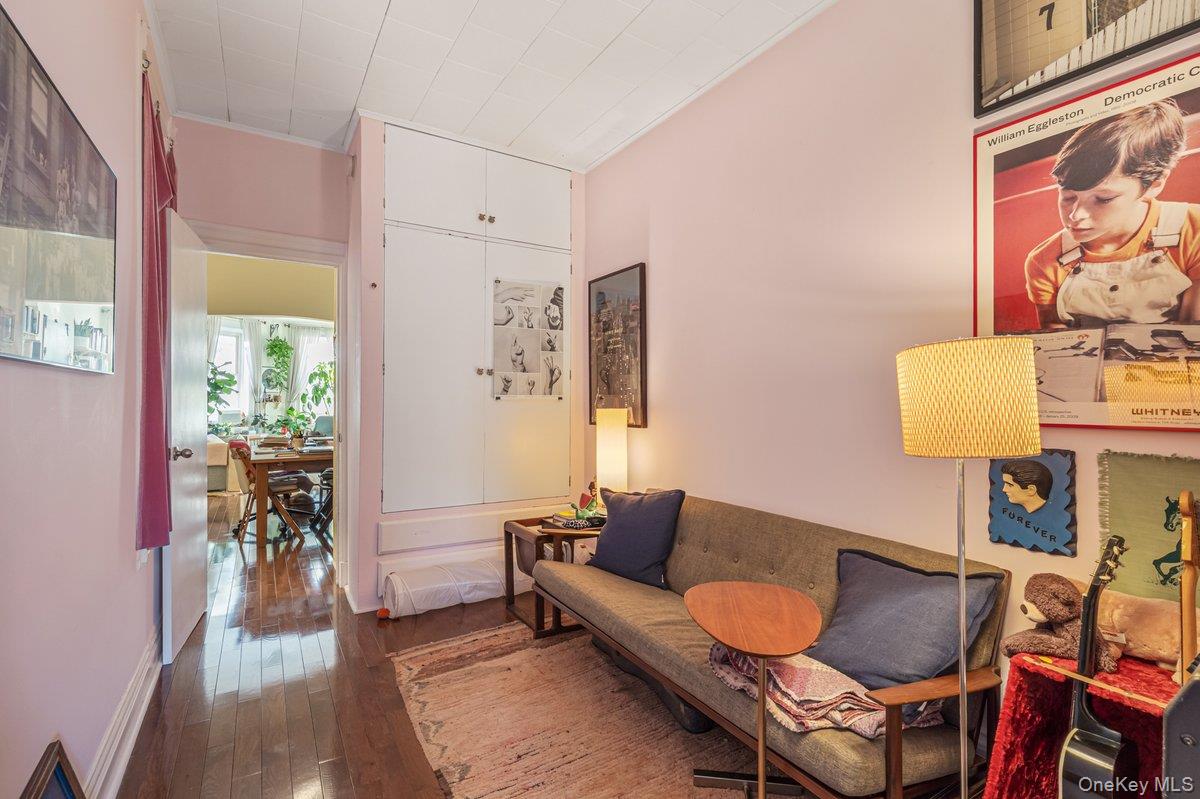 62 Sutton Street Brooklyn, NY 11222 - Photo 10 of 29 a living room with furniture and a lamp
