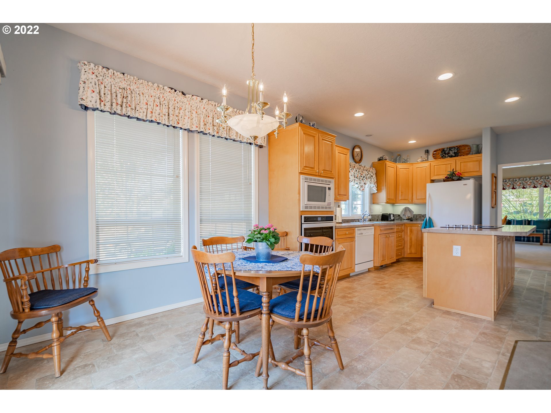 3711 Northwest 114th Street Vancouver, WA 98685 - Photo 12 of 32 a dining room with furniture and a kitchen view