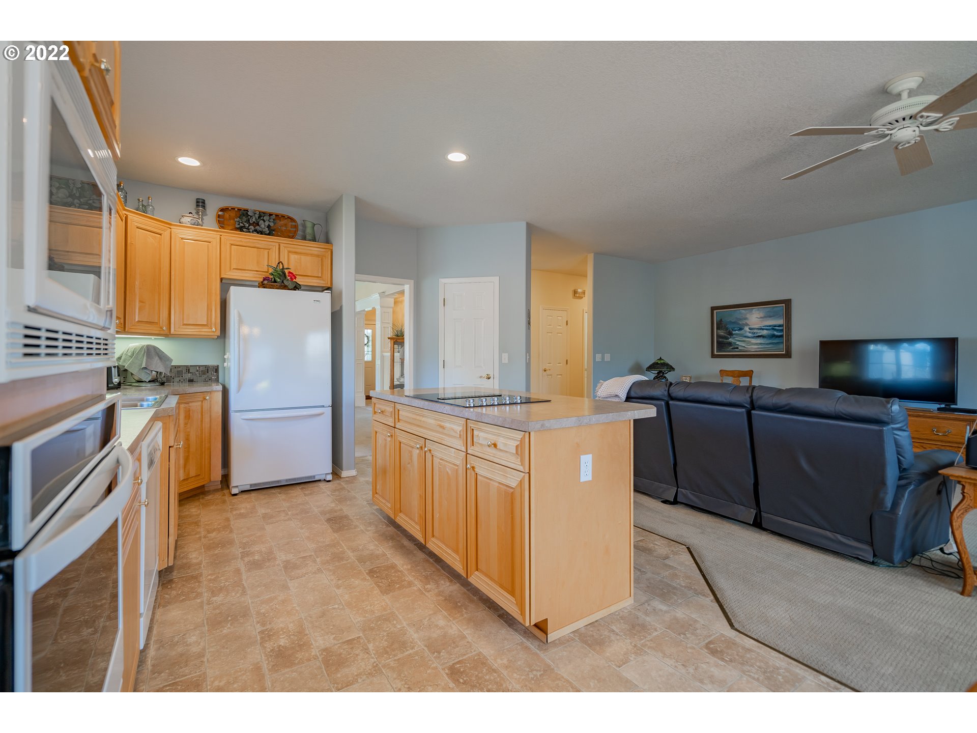 3711 Northwest 114th Street Vancouver, WA 98685 - Photo 14 of 32 a kitchen with granite countertop a refrigerator and a sink