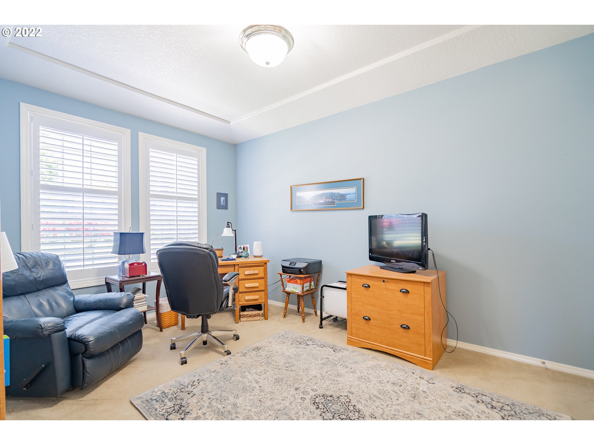 3711 Northwest 114th Street Vancouver, WA 98685 - Photo 24 of 32 a living room with furniture and a flat screen tv