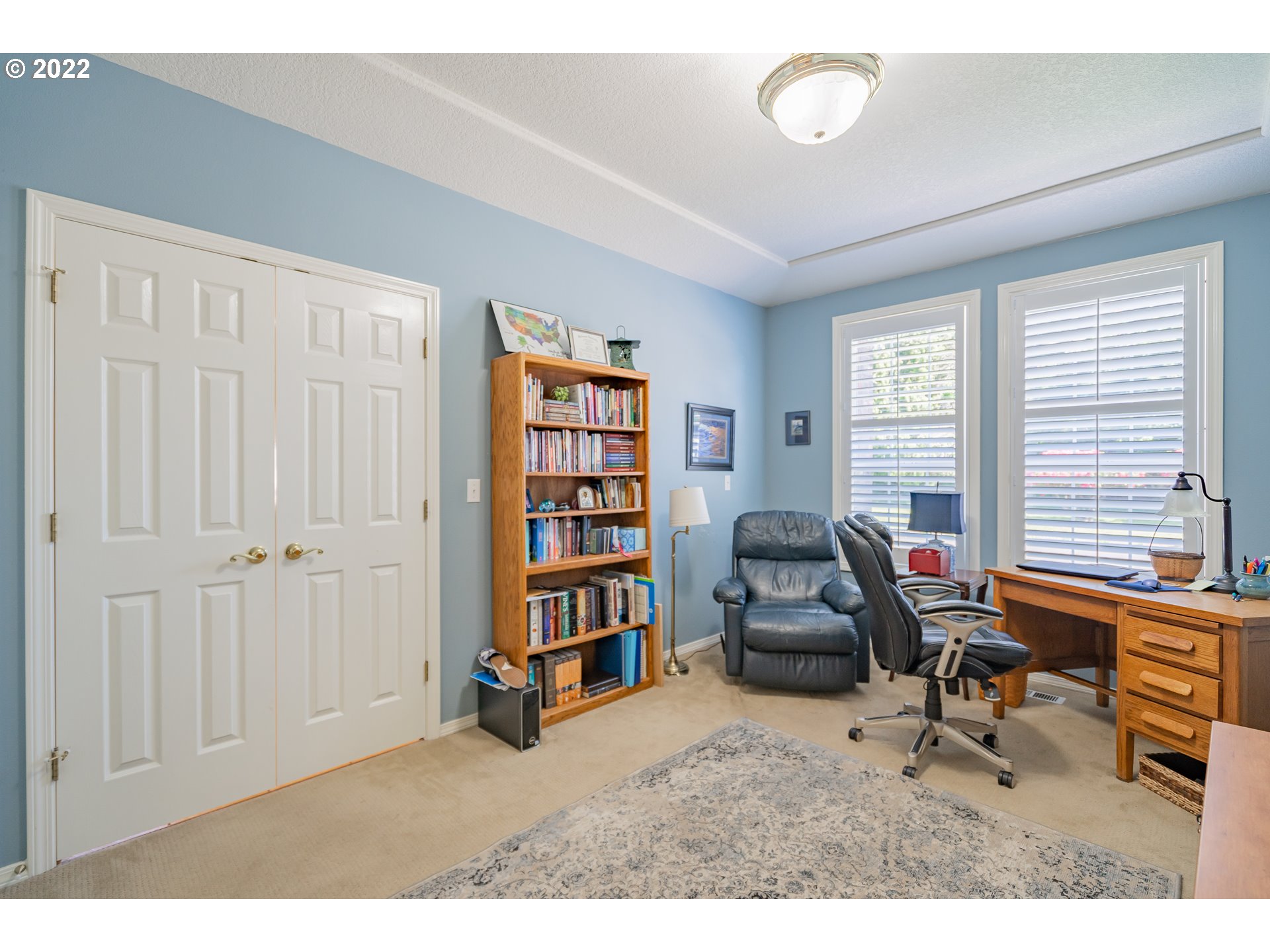 3711 Northwest 114th Street Vancouver, WA 98685 - Photo 25 of 32 a view of a workspace with furniture and a window