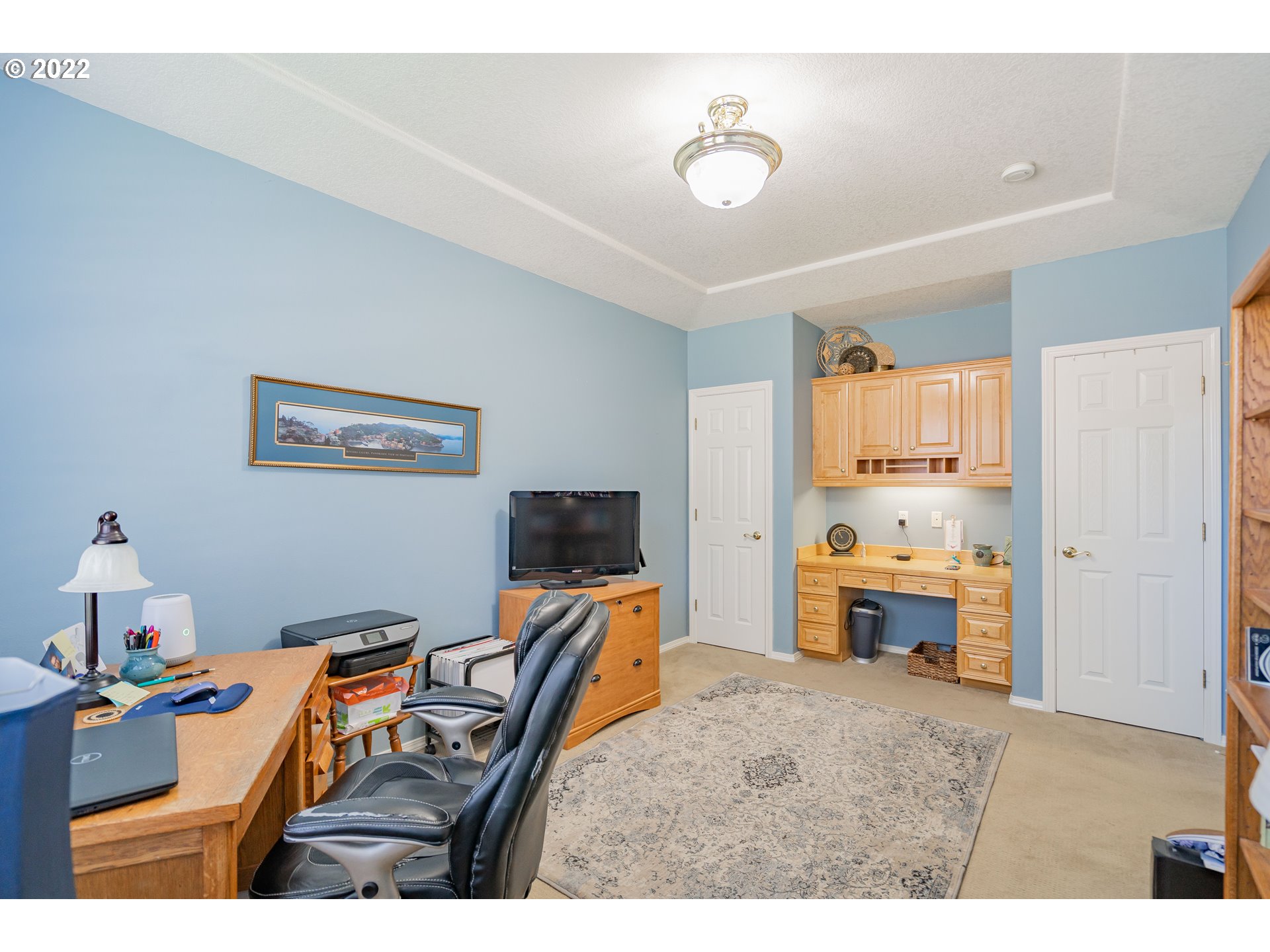 3711 Northwest 114th Street Vancouver, WA 98685 - Photo 26 of 32 a bedroom with furniture and a flat screen tv